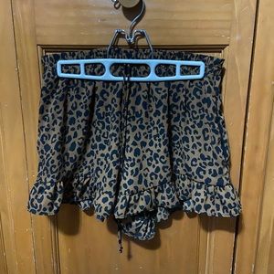 Sienna Sky dress shorts with pockets, false (style) front strings.
